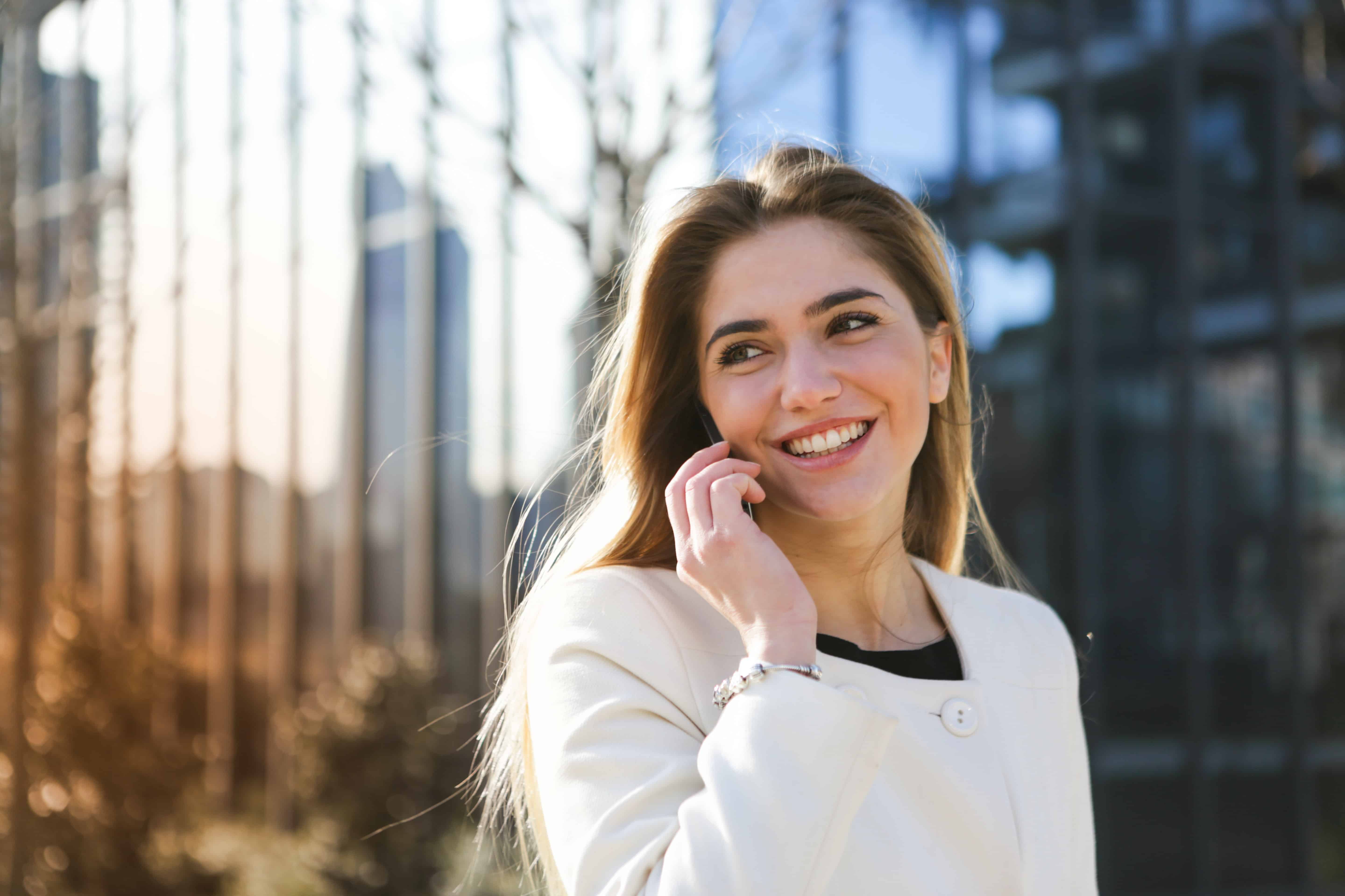 Woman smiling and having a phone call